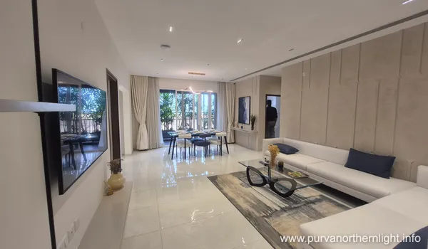 Spacious open-plan living and dining hall at Purva Northern Lights with premium white flooring and contemporary furniture.