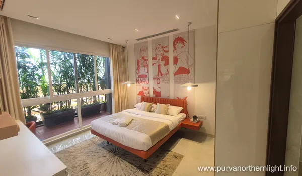 Creative kids bedroom in Purva Northern Lights 3 BHK featuring a Naruto anime wall mural and vibrant orange decor.